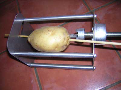 Photo: Potato on skewer into tornado cutting machine